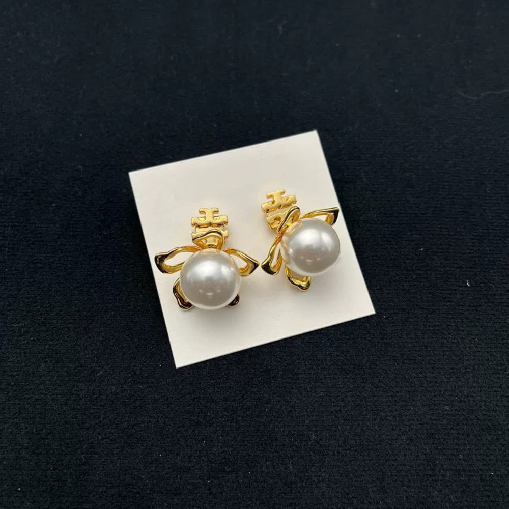Tory Burch Pair of Pearl Inlaid Flower Earrings